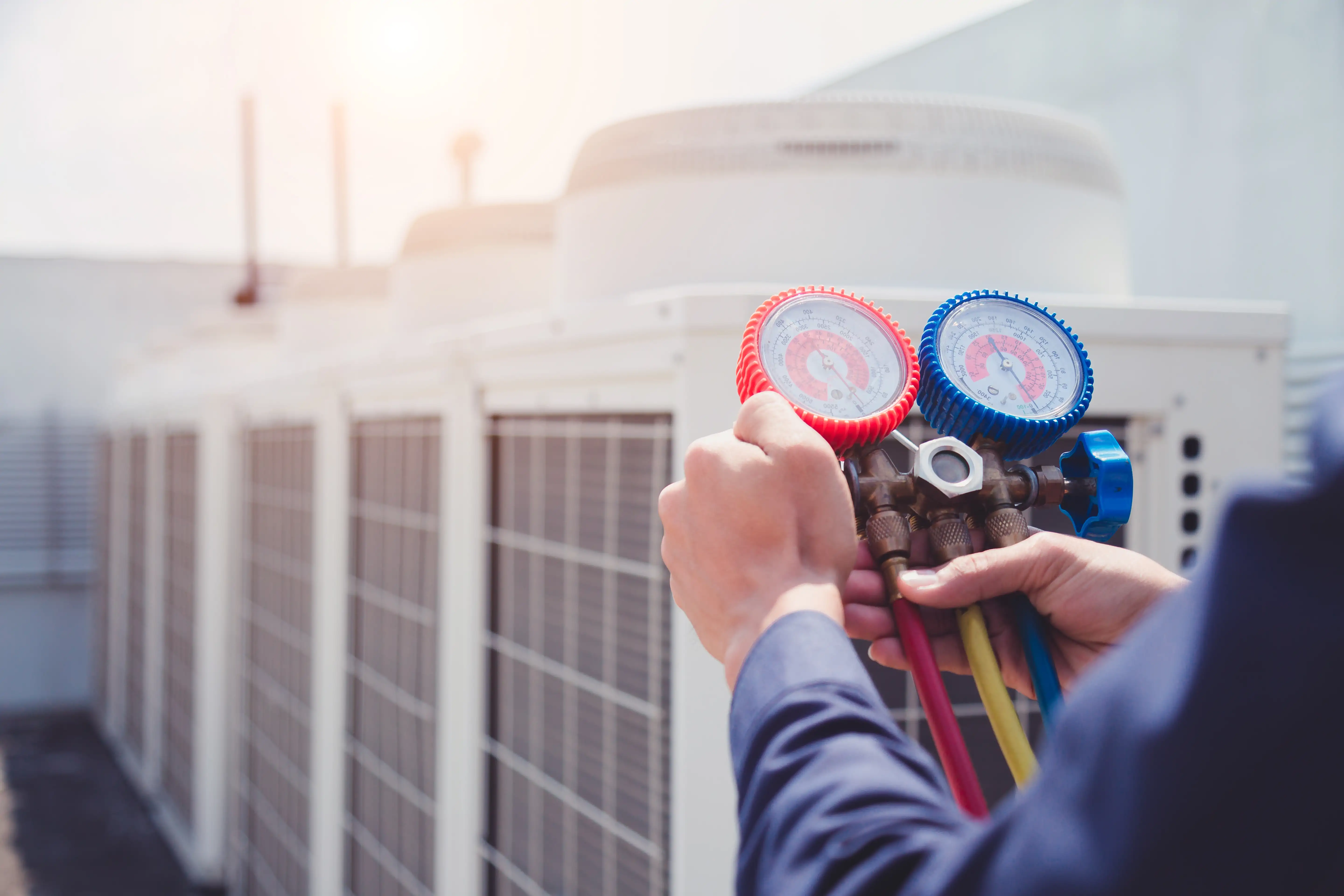 Technician checking air conditioner